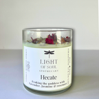 Hecate Candle in a glass jar with roses and rosemary